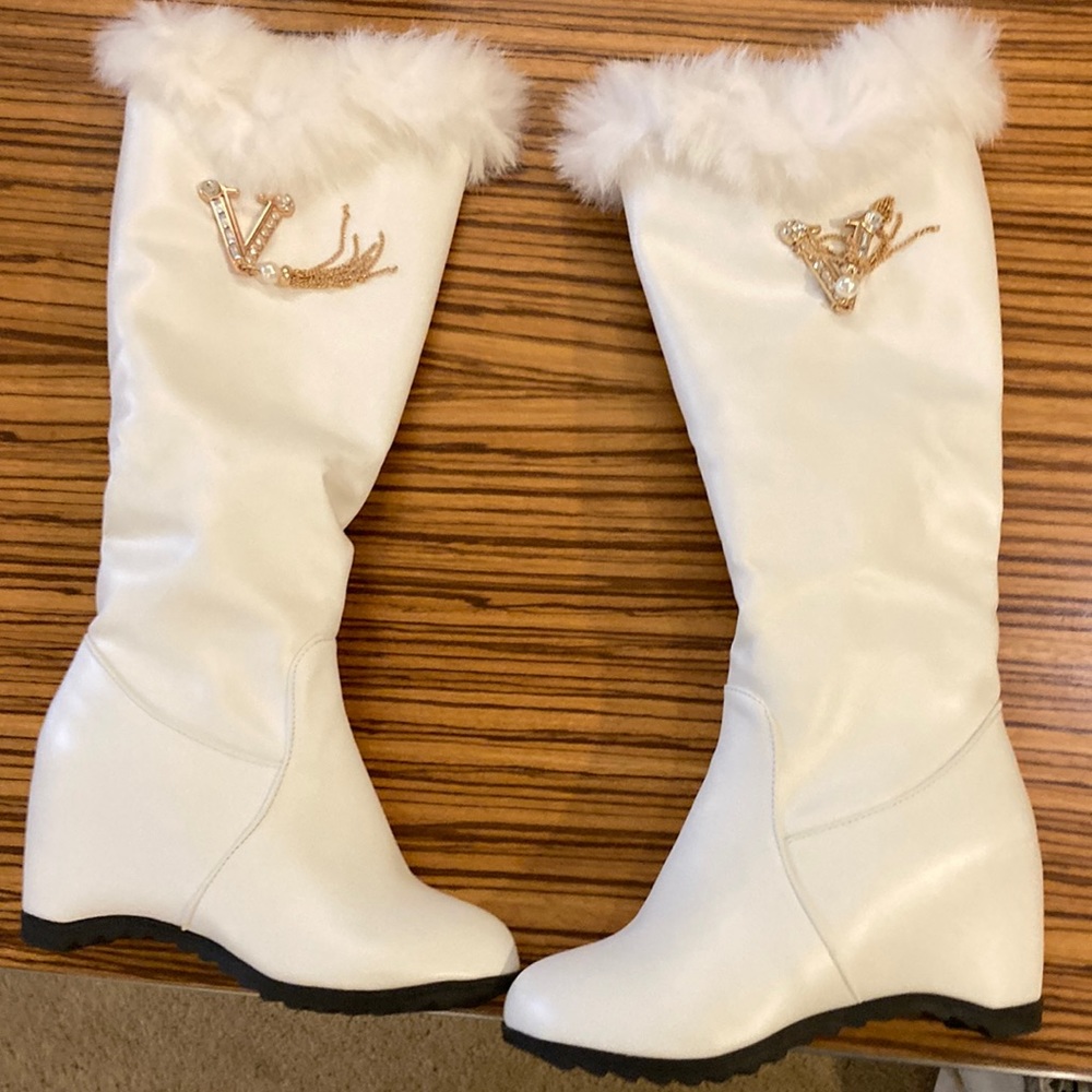 White designer boots with jewls.